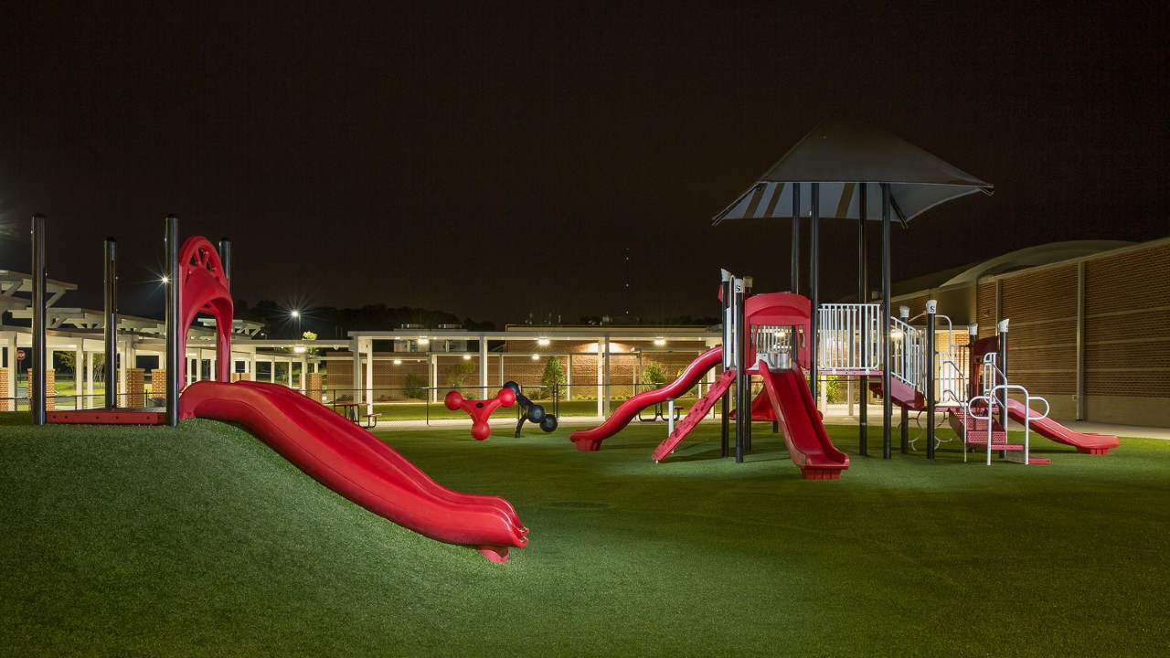 Nighttime artificial turf playground by Southwest Greens of Augusta